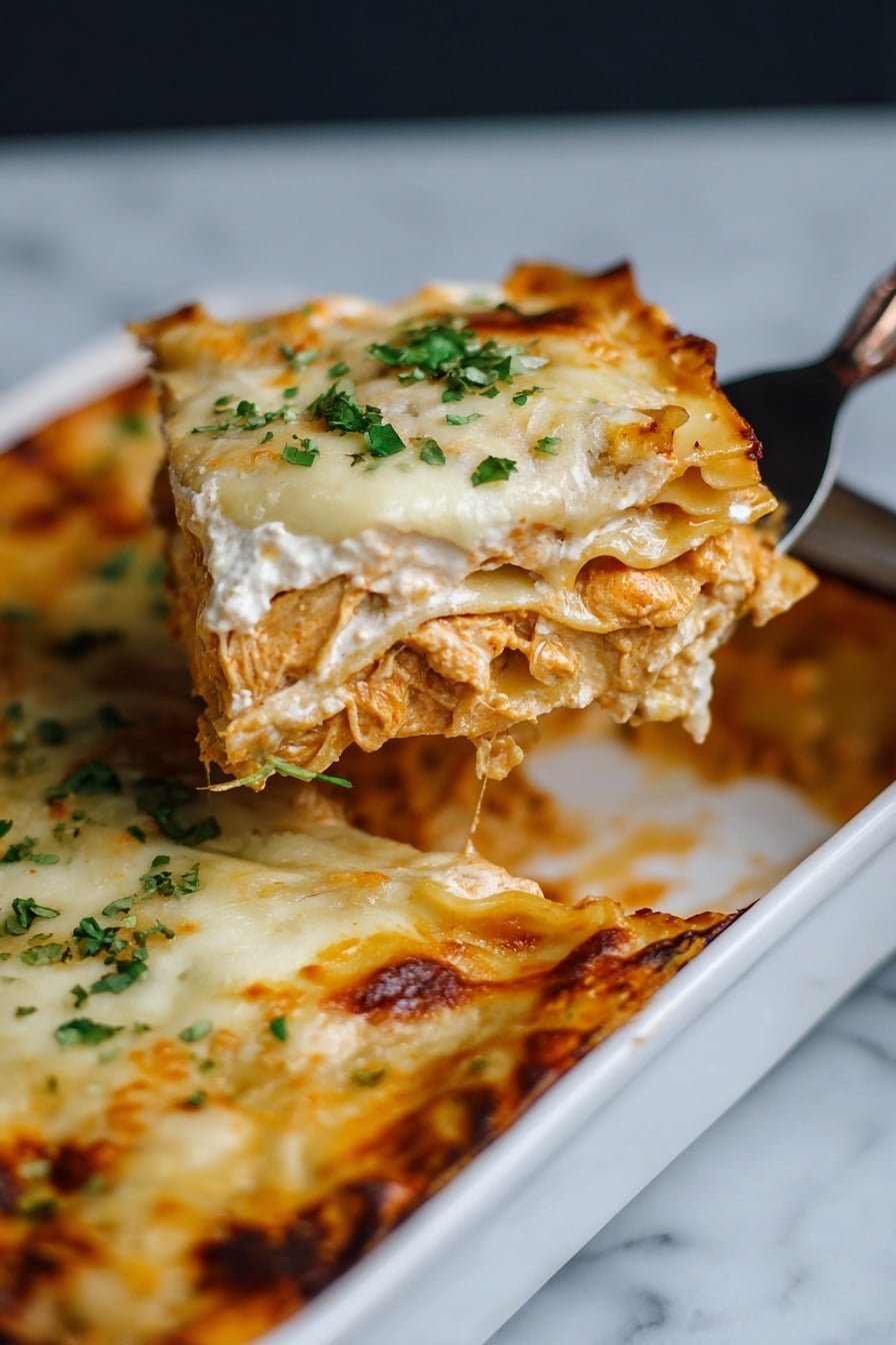 A close-up view of a thick slice of lasagna being lifted from a white baking dish with a silver serving tool held by a woman's hand. The lasagna has multiple layers: a golden-brown melted cheese top with some green chopped herbs sprinkled on it, a creamy white sauce layer beneath that, and a rich orange pasta and filling layer with visible textures of noodles and sauce. The edges of the baking dish show browned, slightly crispy spots of cheese. The background surface is a white marbled texture. photo taken with an iphone --ar 2:3 --v 7