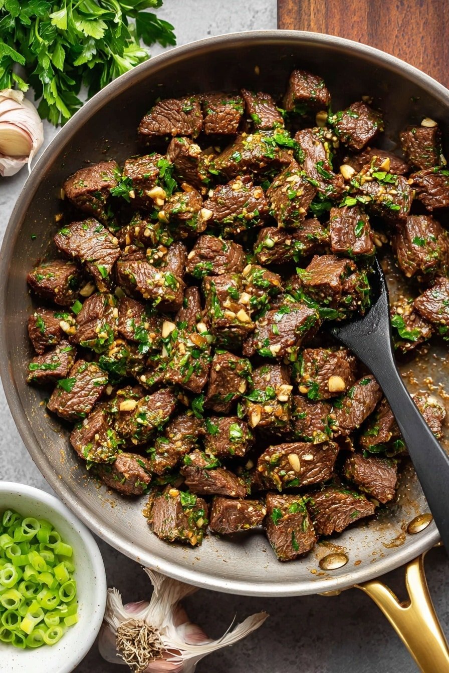 The image shows a black pan filled with many small, browned pieces of cooked beef covered with small bits of garlic and chopped green herbs, mostly parsley. The pan has a golden handle and a wooden spoon resting on the right side, stirring the beef. Around the pan on a white marbled surface, there are two cloves of garlic in the top left corner, a bunch of parsley, and a small white bowl with sliced green onions in the bottom left corner. The overall colors are dark brown from the beef, bright green from the herbs, and light brown from the garlic. Photo taken with an iphone --ar 2:3 --v 7