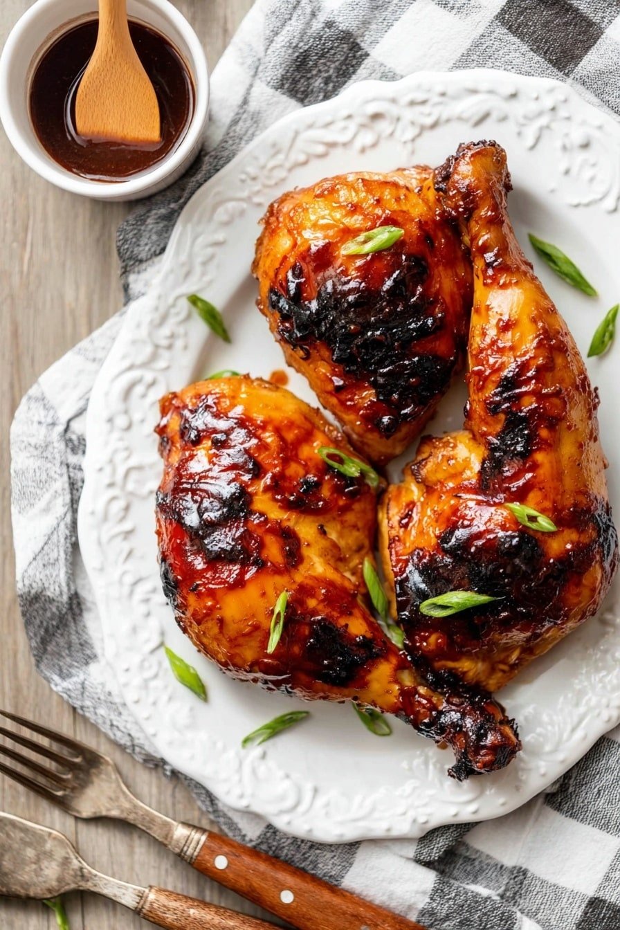On a white oval plate with a beaded edge, there are three roasted chicken pieces, each with a shiny, rich orange-brown glaze with darker charred spots. The chicken skin looks crispy and thickly coated in a sticky sauce. Bright green slices of scallions are scattered over the chicken for color contrast. To the top left of the plate, a small white bowl holds a dark brown sauce with a wooden spoon resting inside it. The plate is placed on a white marbled surface, with a white and black checkered cloth partially underneath. Near the bottom left of the plate, two vintage forks with wooden handles lie beside it. photo taken with an iphone --ar 2:3 --v 7