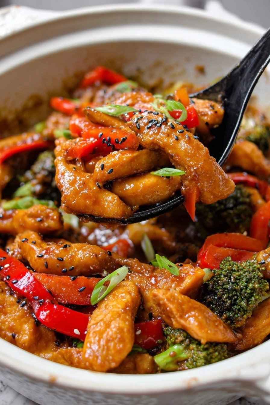 This image shows a close-up of a dish served in an ornate white bowl placed on a white marbled surface. The dish has several pieces of orange-brown, sauce-covered chicken strips mixed with vibrant red bell pepper strips and small green broccoli florets. The chicken pieces and vegetables are coated in a shiny, thick sauce. There are black and white sesame seeds sprinkled over the top, along with small pieces of chopped green onions adding a fresh green touch. A black spoon filled with a mix of the chicken strips, red peppers, broccoli, and sesame seeds is being lifted from the bowl. The colors are bright and appetizing, highlighting the textures of the tender chicken, crunchy vegetables, and smooth sauce. photo taken with an iphone --ar 2:3 --v 7