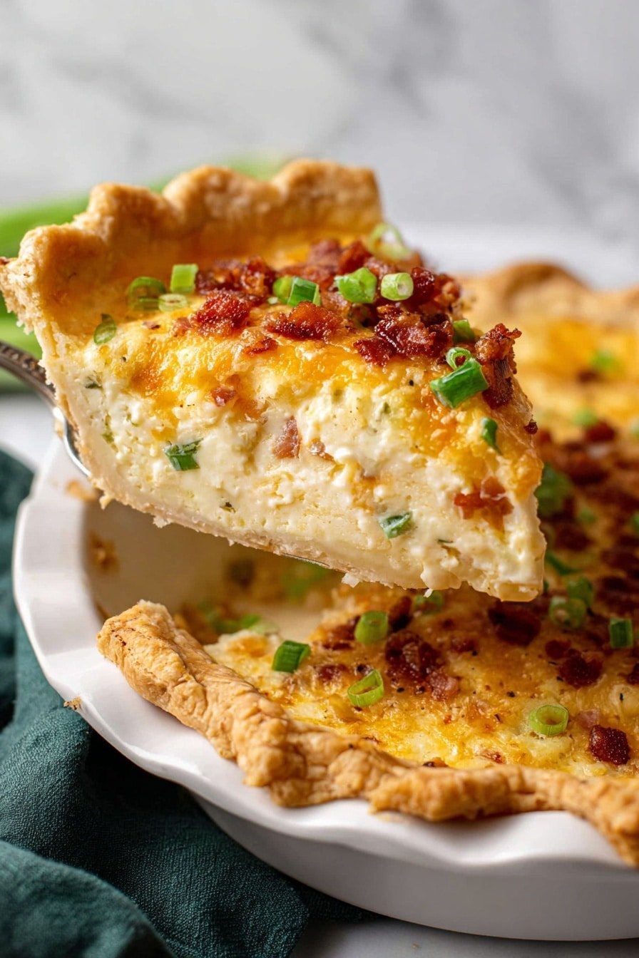 A slice of pie is being lifted from an ornate white pie dish set on a white marbled surface with a dark green cloth nearby. The pie has a golden-brown crust with crimped edges. The slice shows three main layers: a thin bottom crust that is light beige and flaky, a thick creamy filling in the middle that is pale yellow with small bits of filling visible, and a top layer of melted cheese that is golden with crispy reddish-brown bacon pieces and bright green chopped scallions scattered on top. The texture of the filling looks smooth and rich. Photo taken with an iphone --ar 2:3 --v 7