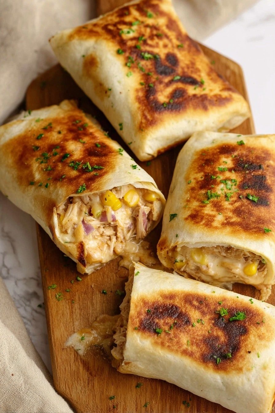 The image shows four folded, golden-brown quesadillas with a slightly crispy texture on the outside, placed on a wooden board. Two of the quesadillas are whole, with dark brown grilled spots and sprinkled green herbs on top. The other two are cut open, showing three layers inside: the outer tortilla, a middle layer of shredded light-colored chicken mixed with yellow corn kernels and small pieces of red onion, and a melted layer of cheese that looks creamy and stringy. The edges of the quesadillas look soft, and the filling is spilling out a bit. The white marbled surface is partly visible around the wooden board with a bit of a white cloth on one side. photo taken with an iphone --ar 2:3 --v 7