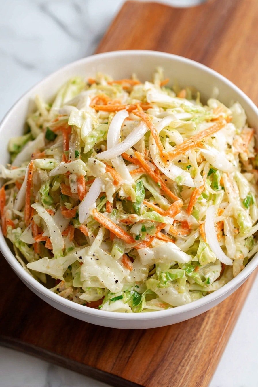 A white bowl filled with three main layers of vegetables: shredded light green cabbage as the bottom layer, thin orange carrot strips mixed throughout the middle layer, and thin white onion slices added evenly on the top layer. The salad has small flecks of black pepper and some green leafy bits scattered inside. The bowl is placed on a wooden board, set against a white marbled textured background. The photo taken with an iphone --ar 2:3 --v 7