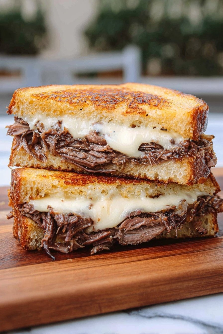 The image shows a close-up side view of a thick sandwich cut in half, stacked one half on top of the other. The sandwich has three layers of golden brown toasted bread with a slightly crispy texture on the outer edges. Between the bread are two layers of shredded dark brown meat, looking tender and juicy, separated by thick layers of melted white cheese that slightly oozes out. The sandwich rests on a wooden cutting board with a visible grain pattern. The background is a soft focus outdoor setting. Photo taken with an iphone --ar 2:3 --v 7