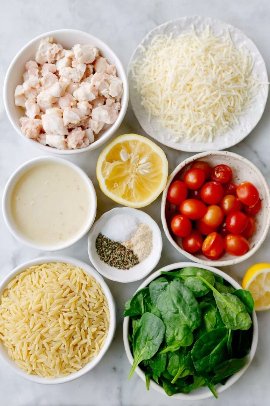 Flat lay of dry orzo pasta scattered loosely, a small white bowl of cooked diced chicken pieces, a small white bowl filled with unsalted chicken stock, a small white bowl of heavy cream, five fresh whole garlic cloves, a small white bowl of grated parmesan cheese, a small white bowl of shredded mozzarella cheese, a small pile of loosely packed chopped baby spinach leaves, a small white bowl filled with whole red cherry tomatoes (some halved), half a fresh lemon cut and showing its juicy flesh, a small white bowl containing mixed Italian seasoning, a few grains of coarse salt beside a small white bowl, freshly cracked black pepper arranged neatly beside another small white bowl, placed on a clean white marble surface, soft natural light, photo taken with an iPhone, professional food photography style, fresh ingredients, white ceramic bowls, no bottles, no duplicates, no utensils, no packaging --ar 2:3 --v 7 --p m7354615311229779997