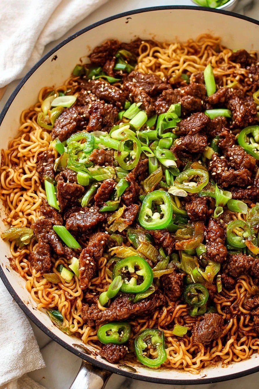 A skillet filled with three main layers: the bottom layer has light brown cooked noodles with a slightly shiny texture, the middle layer has dark brown small pieces of cooked beef, and scattered on top are bright green chopped spring onions and slices of green peppers. A woman's hand is using wooden chopsticks to lift a bundle of noodles from the skillet. The background shows a white marbled texture. photo taken with an iphone --ar 2:3 --v 7