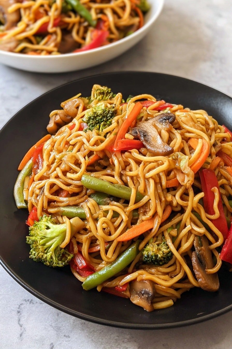 A close-up of a white bowl filled with three layers of cooked noodles mixed with sliced carrots, green beans, broccoli florets, red bell pepper strips, and mushrooms. The noodles are twisted and shiny, coated with a light brown sauce. The vegetables peek through, adding bright pops of orange, green, and red color. The bowl sits on a smooth surface with a white marbled texture, showing part of another white bowl in the background filled with the same noodle dish. Photo taken with an iphone --ar 2:3 --v 7